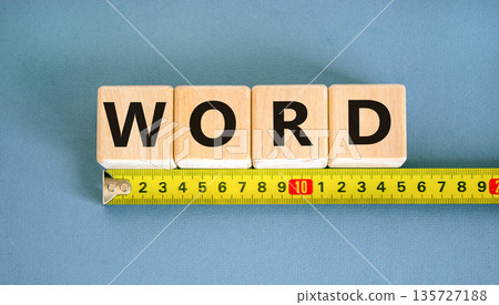 Word symbol. Concept word Word on beautiful wooden blocks. Beautiful yellow ruler. Beautiful blue table blue background. Business, lifestyle, support and word concept. Copy space. 135727188