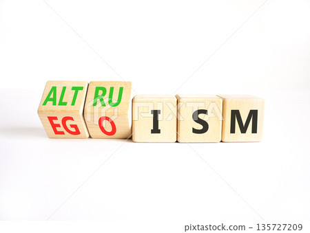 Altruism or egoism symbol. Concept words Egoism to Altruism on beautiful wooden cubes. Beautiful white table white background. Business, psychological and altruism or egoism concept. Copy space. Altruism or egoism symbol. Concept words Egoism to Altruism on beautiful wooden cubes. Beautiful white table white background. Business, psychological and altruism or egoism concept. Copy space. 135727209