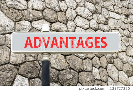 Advantages symbol. Concept word Advantages on beautiful grey road sign. Beautiful stone wall background. Business advantages concept. Copy space. 135727250