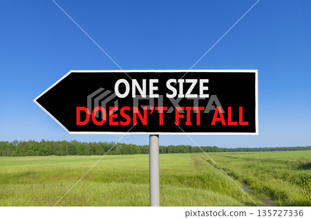 One size does not fit all symbol. Concept words One size does not fit all on beautiful black road sign. Beautiful blue sky field background. Business one size does not fit all concept. Copy space. One size does not fit all symbol. Concept words One size does not fit all on beautiful black road sign. Beautiful blue sky field background. Business one size does not fit all concept. Copy space. 135727336