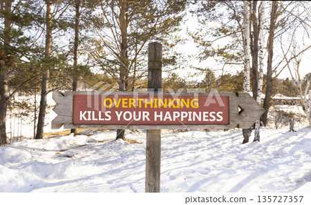 Overthinking kills your happiness symbol. Concept words Overthinking kills your happiness on wooden road sign. Beautiful forest background. Business overthinking kills happiness concept. Copy space. Overthinking kills your happiness symbol. Concept words Overthinking kills your happiness on wooden road sign. Beautiful forest background. Business overthinking kills happiness concept. Copy space. 135727357