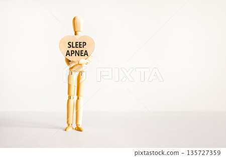 Sleep apnea symbol. Concept words Sleep apnea on beautiful wooden heart. Doctor's model. Beautiful white background. Copy space. Medical healthy lifestyle sleep apnea concept. Sleep apnea symbol. Concept words Sleep apnea on beautiful wooden heart. Doctor's model. Beautiful white background. Copy space. Medical healthy lifestyle sleep apnea concept. 135727359