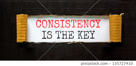 Consistency is the key symbol. Concept words Consistency is the key on beautiful white paper. Beautiful black paper background. Business consistency is the key concept. Copy space. Consistency is the key symbol. Concept words Consistency is the key on beautiful white paper. Beautiful black paper background. Business consistency is the key concept. Copy space. 135727410