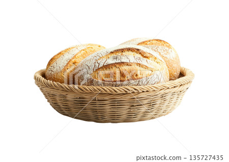 A beautifully arranged basket of freshly baked round breads, perfect for culinary, baking, and food presentation themes. 135727435