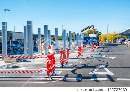 Construction Process in Public Parking Area with Crane Vehicle Construction Process in Public Parking Area with Crane Vehicle 135727683