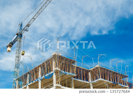Urban Building Construction with Scaffolding and Crane 135727684