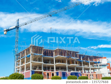 Urban Building Construction with Scaffolding and Crane Urban Building Construction with Scaffolding and Crane 135727688