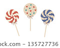 A set of three cute vector holiday lollipops in a swirl design. Features red, blue, and a heart-patterned sweet in soft 135727736