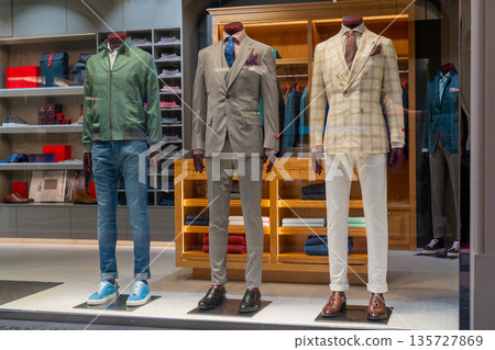 Male dummy in a shop window. Sale of men's clothing. 135727869