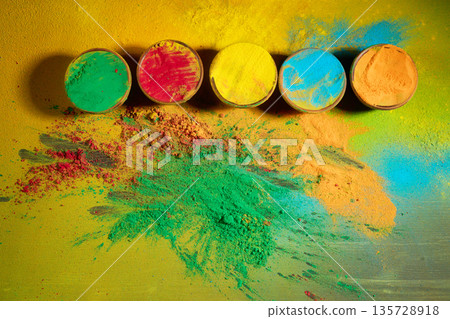 Holi festival celebration with colorful gulal powder and pigment Holi festival celebration with colorful gulal powder and pigment 135728918