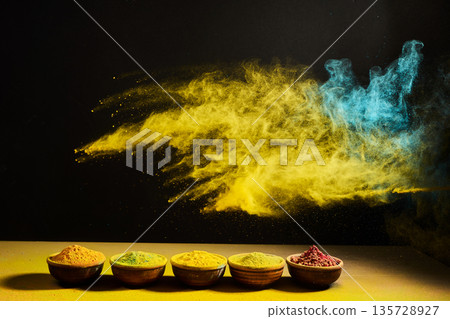 Spicy colorful powder explosion bursting from bowls Spicy colorful powder explosion bursting from bowls 135728927