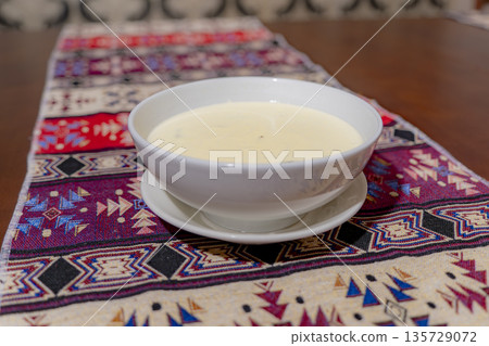 A dish on a plate. A dish on a plate. 135729072