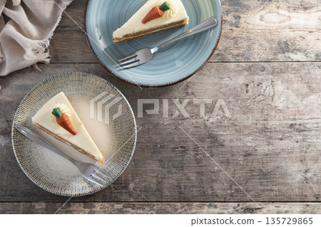 Carrot cake slice with cream cheese frosting Carrot cake slice with cream cheese frosting 135729865
