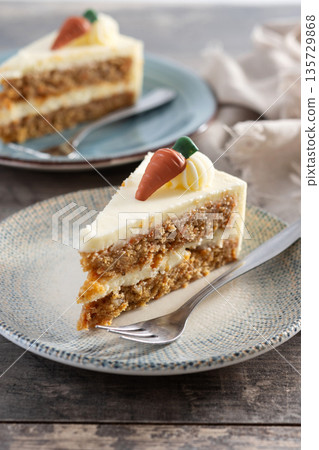 Carrot cake slice with cream cheese frosting Carrot cake slice with cream cheese frosting 135729868