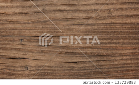 Wood Surface With Texture and Grain Details Showing Natural Patterns and Tones in a Rustic Setting 135729888