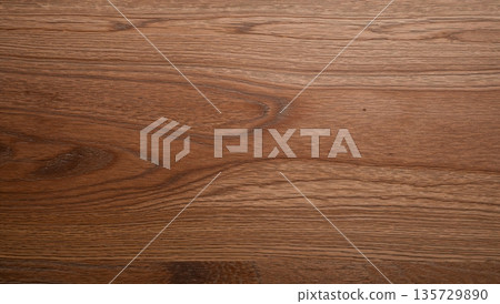 Wood Surface With Texture and Grain Details Showing Natural Patterns and Tones in a Rustic Setting 135729890
