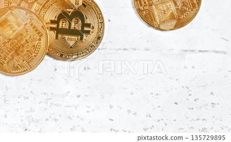 Top down view, golden commemorative btc - bitcoin cryptocurrency - coins on white stone board, closeup detail, space for text down right corner Top down view, golden commemorative btc - bitcoin cryptocurrency - coins on white stone board, closeup detail, space for text down right corner 135729895