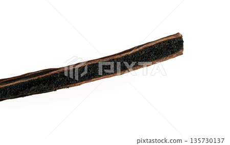Vanilla pod cut with knife, aromatic seeds visible, closeup detail photo isolated on white background Vanilla pod cut with knife, aromatic seeds visible, closeup detail photo isolated on white background 135730137