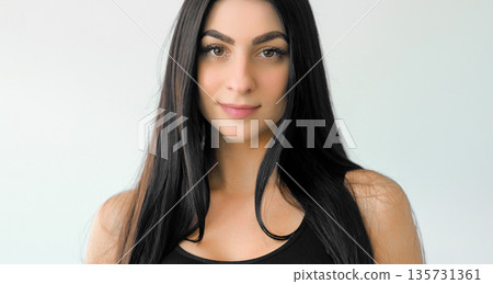 Pretty woman. Confident face. Natural beauty girl posing with healthy fresh skin. Attractive female isolated on white background free space. 135731361