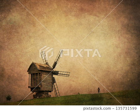 Vintage-style photo of an old wooden windmill on a grassy hill, adding textured overlay for an aged, nostalgic look A fairytale rural historical scene 135731599