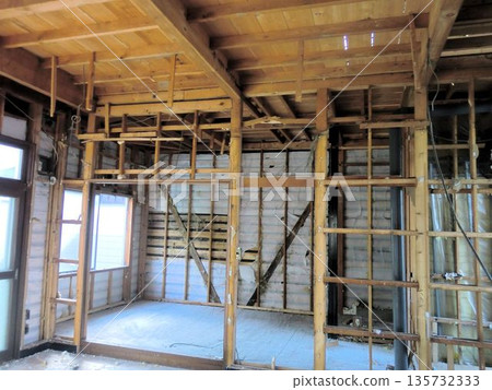 Wooden house frame structure undergoing internal demolition work Wooden house frame structure undergoing internal demolition work 135732333