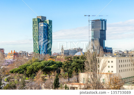 Urban development and modern architecture with tall buildings, city growth and contemporary skyline in Tirana, Albania Urban development and modern architecture with tall buildings, city growth and contemporary skyline in Tirana, Albania 135733089