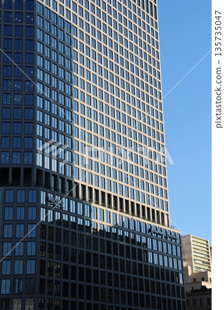 Cityscape: Shadows of buildings reflected in skyscrapers Cityscape: Shadows of buildings reflected in skyscrapers 135735047