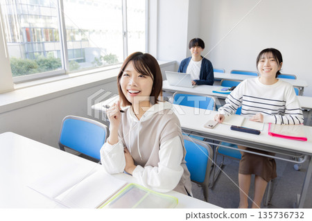 College students taking classes in the classroom College students taking classes in the classroom 135736732