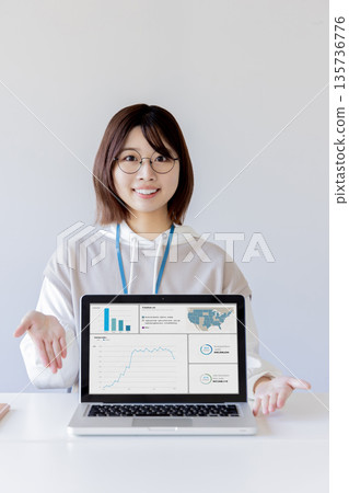 Introducing with a laptop - IT student 135736776
