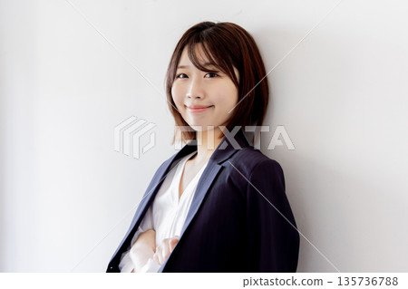 Business woman wearing a suit Business woman wearing a suit 135736788