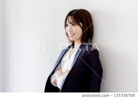 Business woman wearing a suit Business woman wearing a suit 135736789