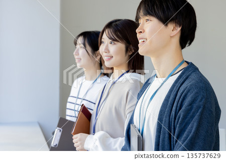 Young men and women in casual office Young men and women in casual office 135737629