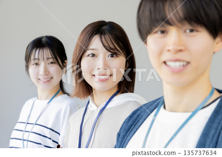 Young men and women in casual office Young men and women in casual office 135737634