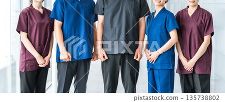 Doctors, caregivers, and osteopaths wearing scrubs Doctors, caregivers, and osteopaths wearing scrubs 135738802