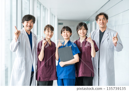 Medical workers in scrubs, medical staff, female nurses and male doctors in white coats Medical workers in scrubs, medical staff, female nurses and male doctors in white coats 135739135