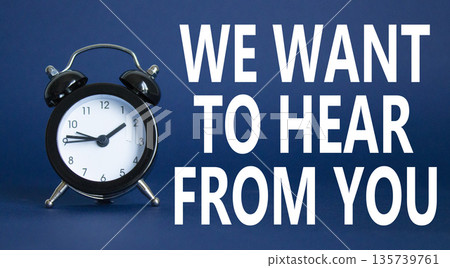 We want to hear from you symbol. Wooden blocks with words We want to hear from you. Beautiful deep blue background with alarm clock. Business and We want to hear from you. Copy space. We want to hear from you symbol. Wooden blocks with words We want to hear from you. Beautiful deep blue background with alarm clock. Business and We want to hear from you. Copy space. 135739761
