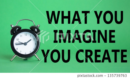 What you Imagine you Create you symbol. Wooden blocks with words What you Imagine you Create. Beautiful green background with alarm clock. What you Imagine you Create concept. Copy space. 135739763