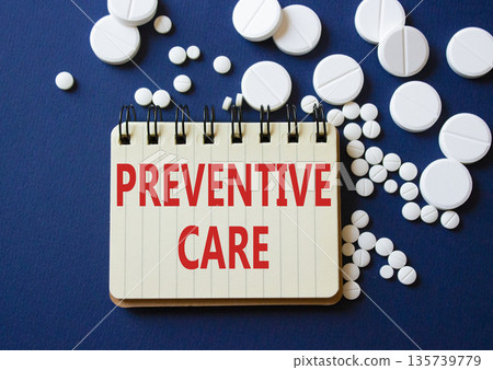 Preventive Care symbol. Concept word Preventive Care on notebook. Beautiful deep blue background with pills. Medicine and Preventive Care concept. Copy space Preventive Care symbol. Concept word Preventive Care on notebook. Beautiful deep blue background with pills. Medicine and Preventive Care concept. Copy space 135739779