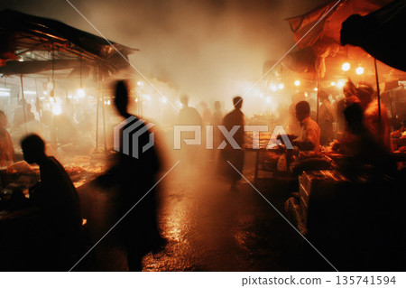 Busy wet market stall scene with people moving through misty air illuminated by warm lights creating lively and atmospheric environment at night 135741594