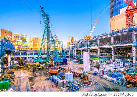 Tokyo cityscape, Japan, January 23rd. A rare view of the Ginza Line and the new construction plan for the facility above the west exit of Shibuya Station. NTT Doco Yoyogi Building is in the far right. Tokyo cityscape, Japan, January 23rd. A rare view of the Ginza Line and the new construction plan for the facility above the west exit of Shibuya Station. NTT Doco Yoyogi Building is in the far right. 135743303