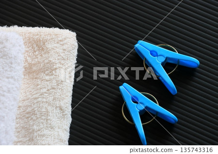 Clothespins and folded towels Clothespins and folded towels 135743316