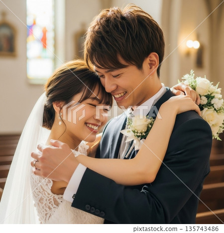 Young bride and groom embracing at wedding venue 135743486