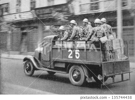 Old photo from 1937 in Shanghai during the Second Sino-Japanese War, showing a medical corps truck heading to the front line Old photo from 1937 in Shanghai during the Second Sino-Japanese War, showing a medical corps truck heading to the front line 135744438