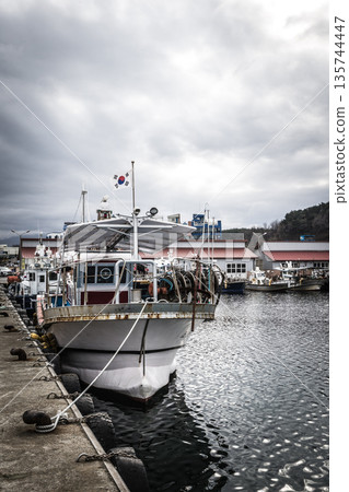 Resting and fishing boats at Naksan Port 135744447