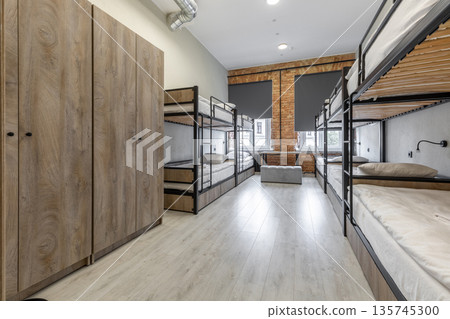 Hostel dormitory with wooden wardrobes and industrial bunk beds Hostel dormitory with wooden wardrobes and industrial bunk beds 135745300
