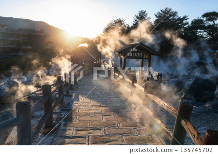 Walking trail with gas in Mount Unzen and hot springs at sunset, Nagasaki 135745702
