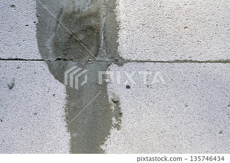 Joint between two concrete blocks, sealed with cement Joint between two concrete blocks, sealed with cement 135746434