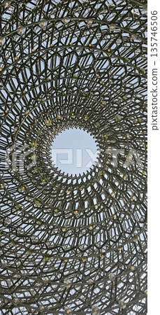 A large, circular metal lattice dome with concentric rings, creating a geometric architectural pattern 135746506