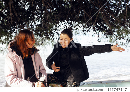 two girls friends walking together outside, lifestyle people concept 135747147