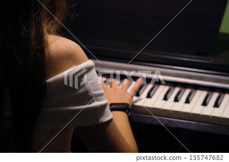 hands play on piano keyboard hands play on piano keyboard 135747682